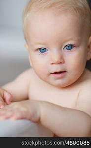 Baby boy with blue eyes portrait