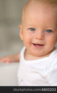 Baby boy with blue eyes portrait