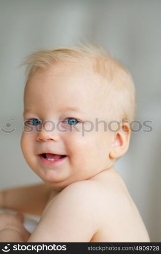 Baby boy with blue eyes portrait