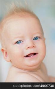 Baby boy with blue eyes portrait