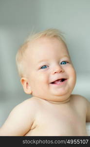 Baby boy with blue eyes portrait