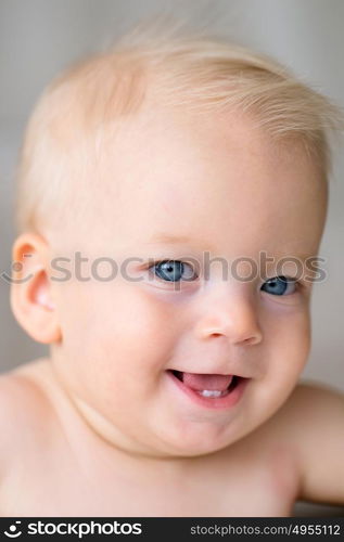 Baby boy with blue eyes portrait