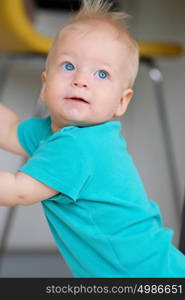 Baby boy with blue eyes portrait