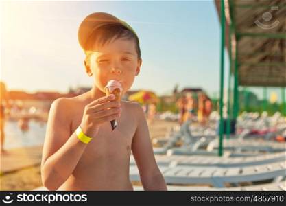 Baby boy with ice-cream at the beach. ice-cream