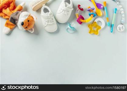 Baby care or baby shower concept. Flat Lay. Newborn or baby cloth, toys, nipple and bottle for feeding.