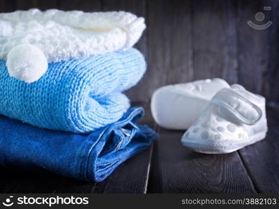 baby clothes for boy on the wooden table