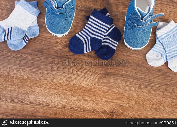 Baby clothing for newborn, expecting for kids and extending family concept, copy spac for text or inscription. Clothing for newborn, expecting for kids concept, copy space for text