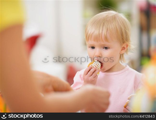 Baby eating Easter cookie