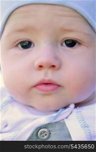 Baby face, close up portrait outdoors