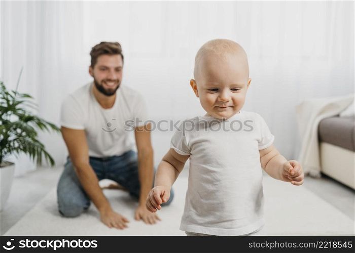 baby father playing together home