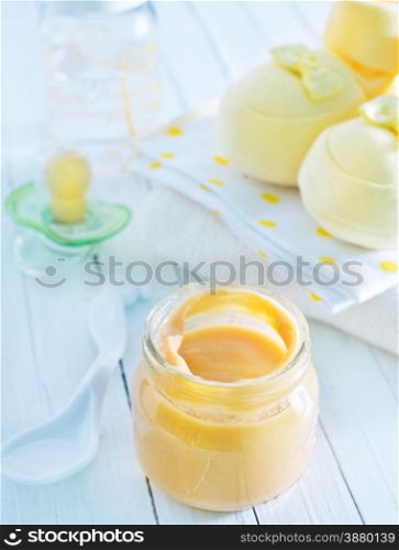 baby food in the glass bank and on a table