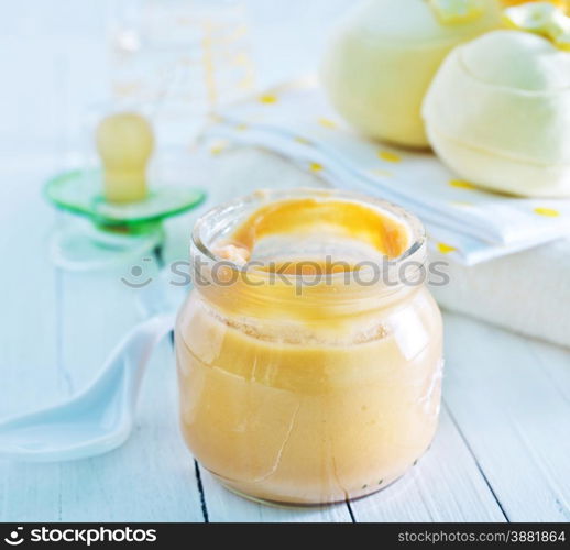 baby food in the glass bank and on a table