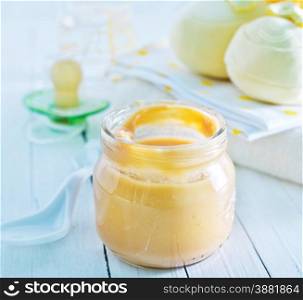 baby food in the glass bank and on a table