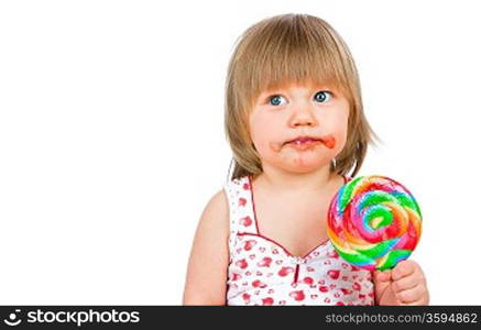 Baby girl eating a sticky lollipop on white background