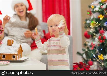 Baby girl enjoying Christmas cookies