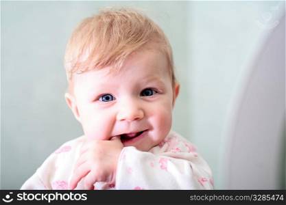 baby girl face with smile expression indoors
