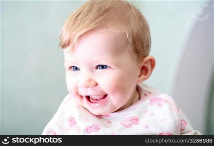baby girl face with smile expression indoors