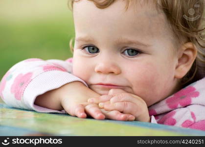 baby girl isolated on green