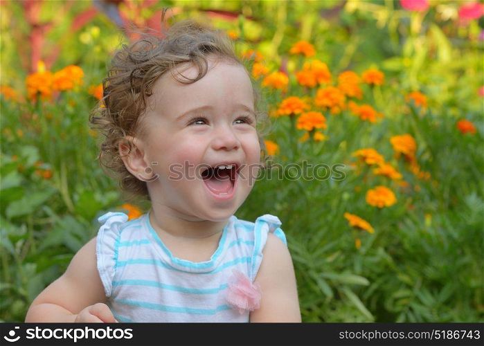 baby girl laughing in nature