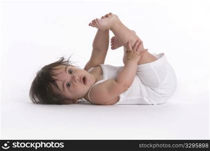 Baby Girl Lying On The Floor With With One Leg Up Like Fitness