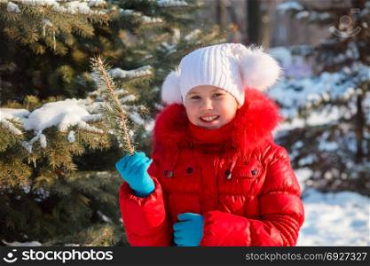 Baby girl on a background of a winter landscape.