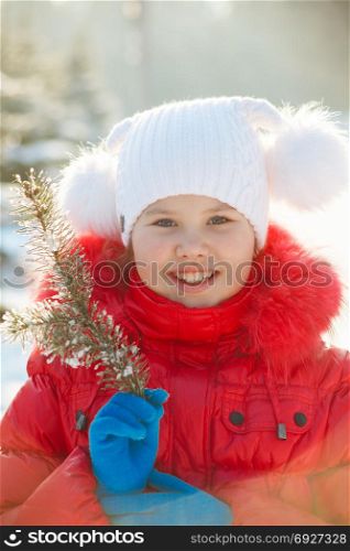 Baby girl on a background of a winter landscape.
