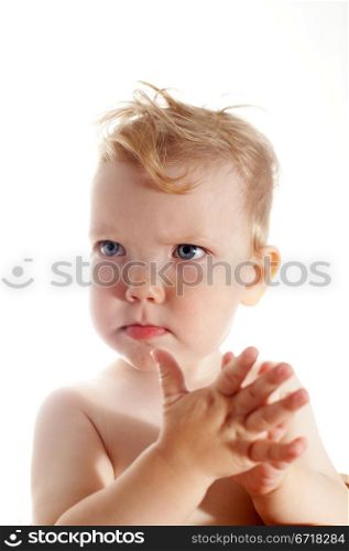 Baby-girl on white background. Children&rsquo;s emotions - irritation