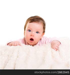 baby girl open mouth funny gesture in pink with winter white fur background