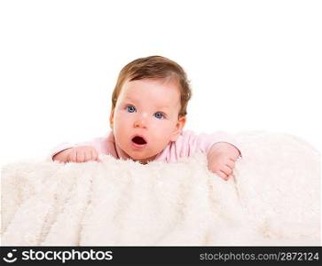 baby girl open mouth funny gesture in pink with winter white fur background