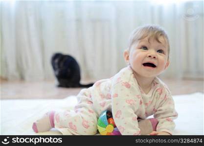 baby girl playing with smile expression indoors