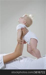 Baby girl resting in mother&acute;s hands