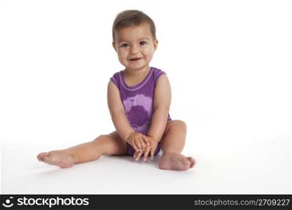 Baby girl sitting on the floor