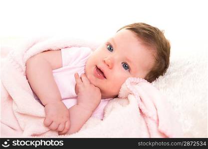 baby girl smiling dress in pink with winter white fur background