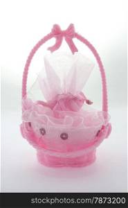 baby girl souvenir? Small pink plastic basket for candy.