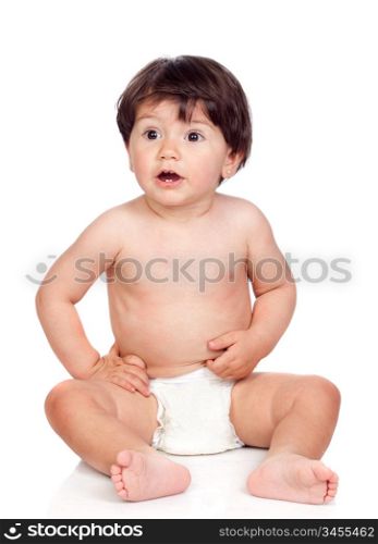 Baby girl with diaper sitting on a over white background