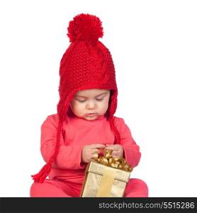 Baby girl with wool hat looking a gift isolated on white background