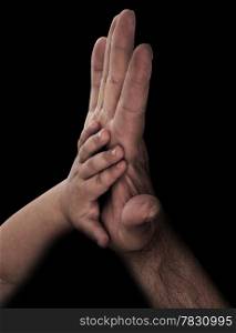 baby hand with father&rsquo;s hand
