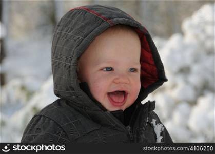 Baby having fun in the snow
