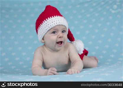 Baby in christmas hat. Happy Santa Christmas baby