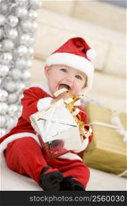 Baby In Santa Costume At Christmas