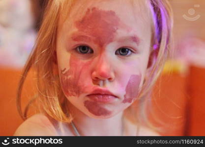 Baby little girl draws with colored inks