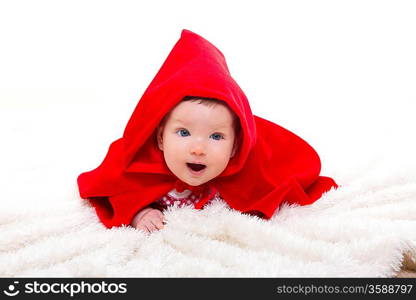 Baby Little Red Riding Hood on white fur with funny expression