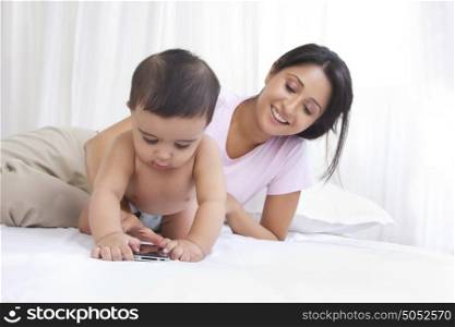 Baby looking at mobile phone