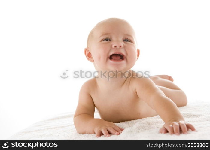 Baby lying down smiling