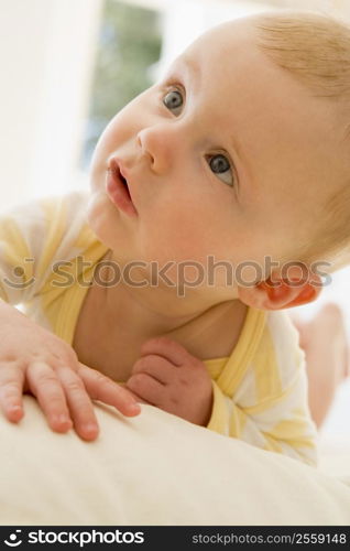 Baby lying indoors