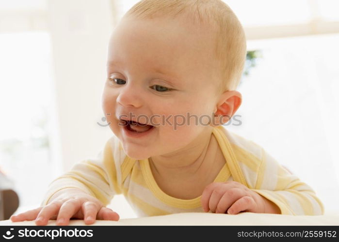 Baby lying indoors