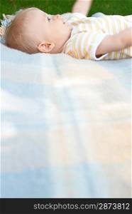 Baby Lying on Blanket