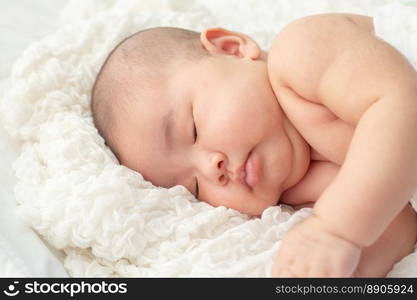 Baby lying on the bed