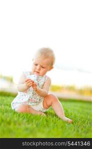Baby playing on grass
