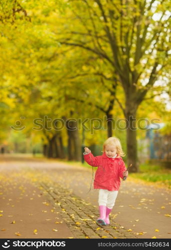 Baby running in park